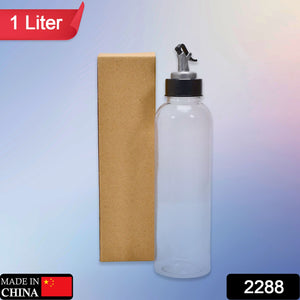 1-liter clear plastic oil dispenser with a drip-free spout, ideal for kitchen use.